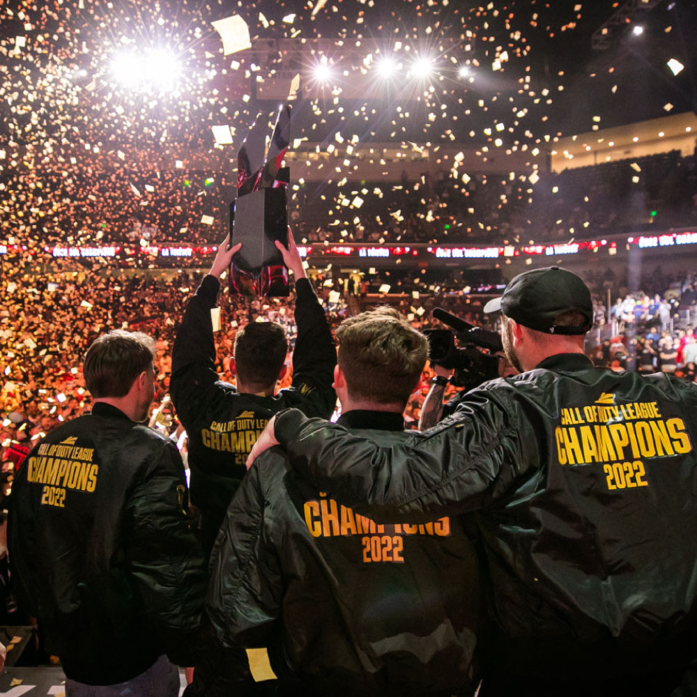 LA Thieves players lift the trophy amid confetti at the 2022 championship
