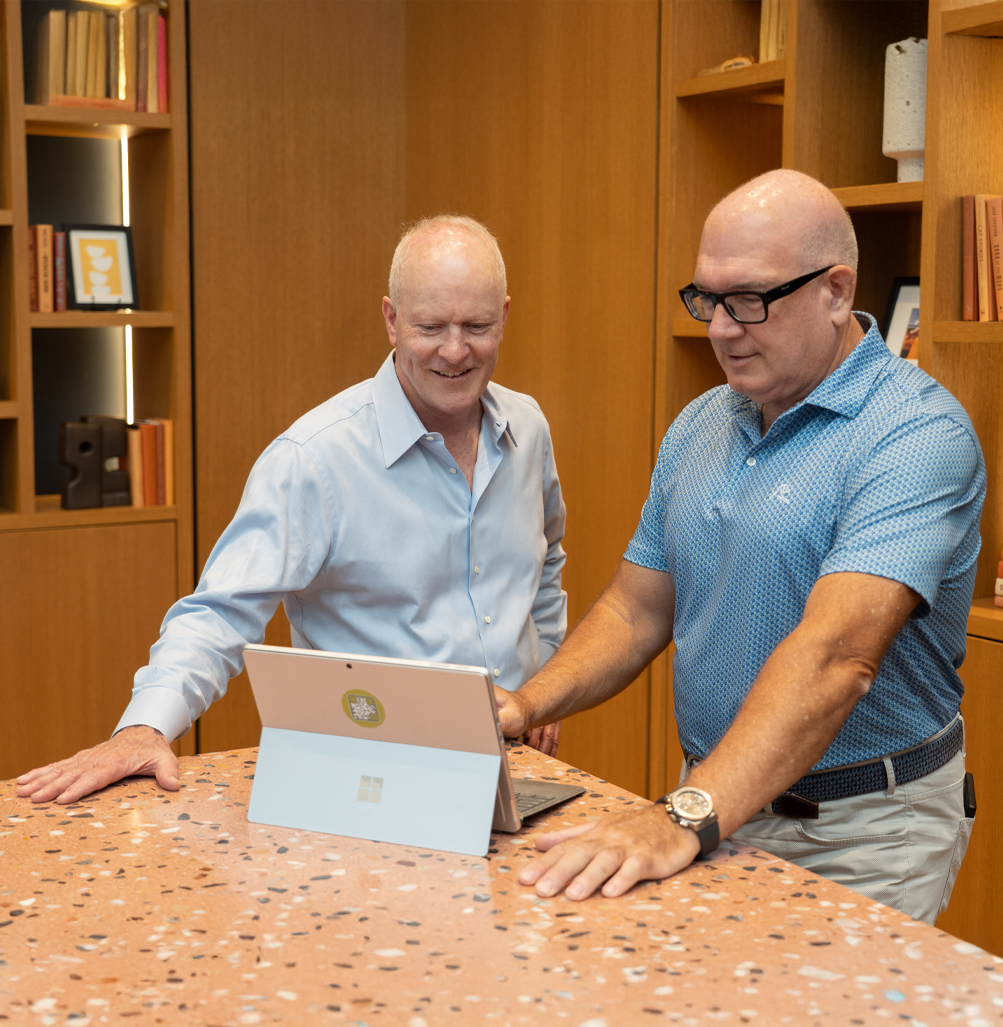 Richard Blaylock and Greg Puklicz reviewing a laptop together