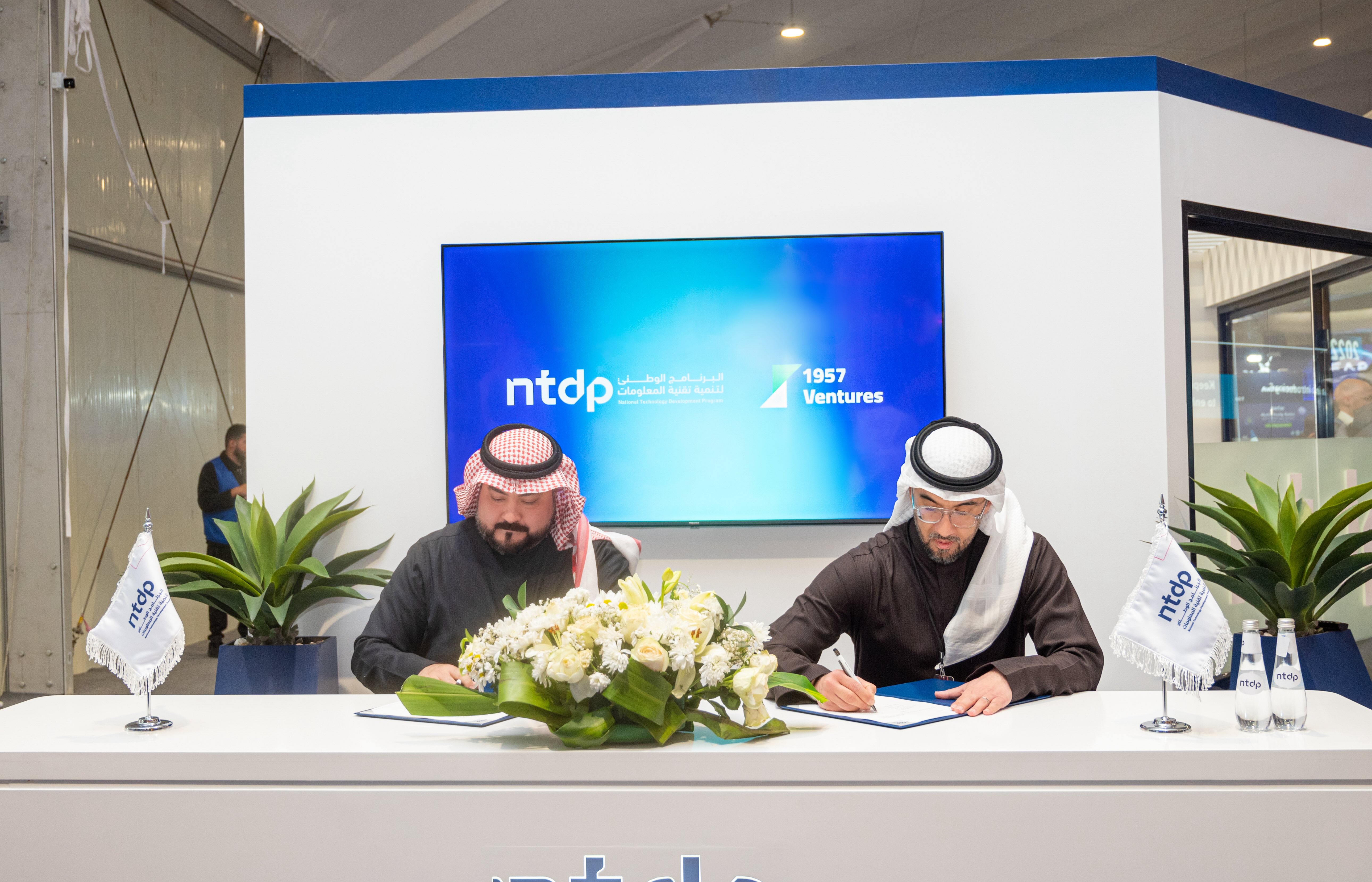 Representatives sign the NTDP and 1957 Ventures partnership agreement at LEAP 2025