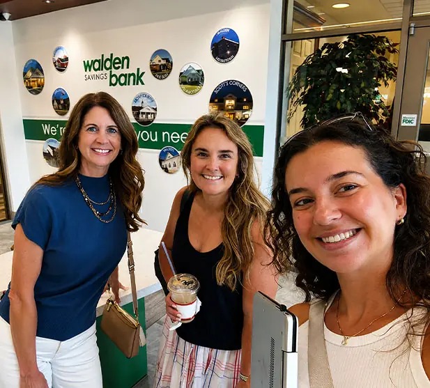Three marketing professionals visiting a client location