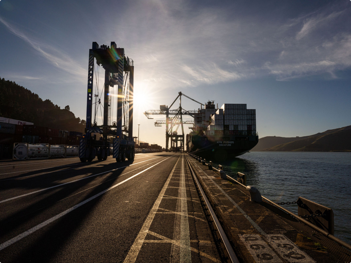 Lyttelton Port with cranes, container stacks and working waterfront
