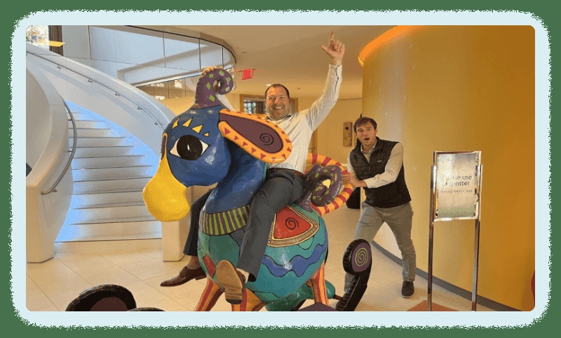 314e team members visiting Epic’s headquarters with a colorful sculptural animal
