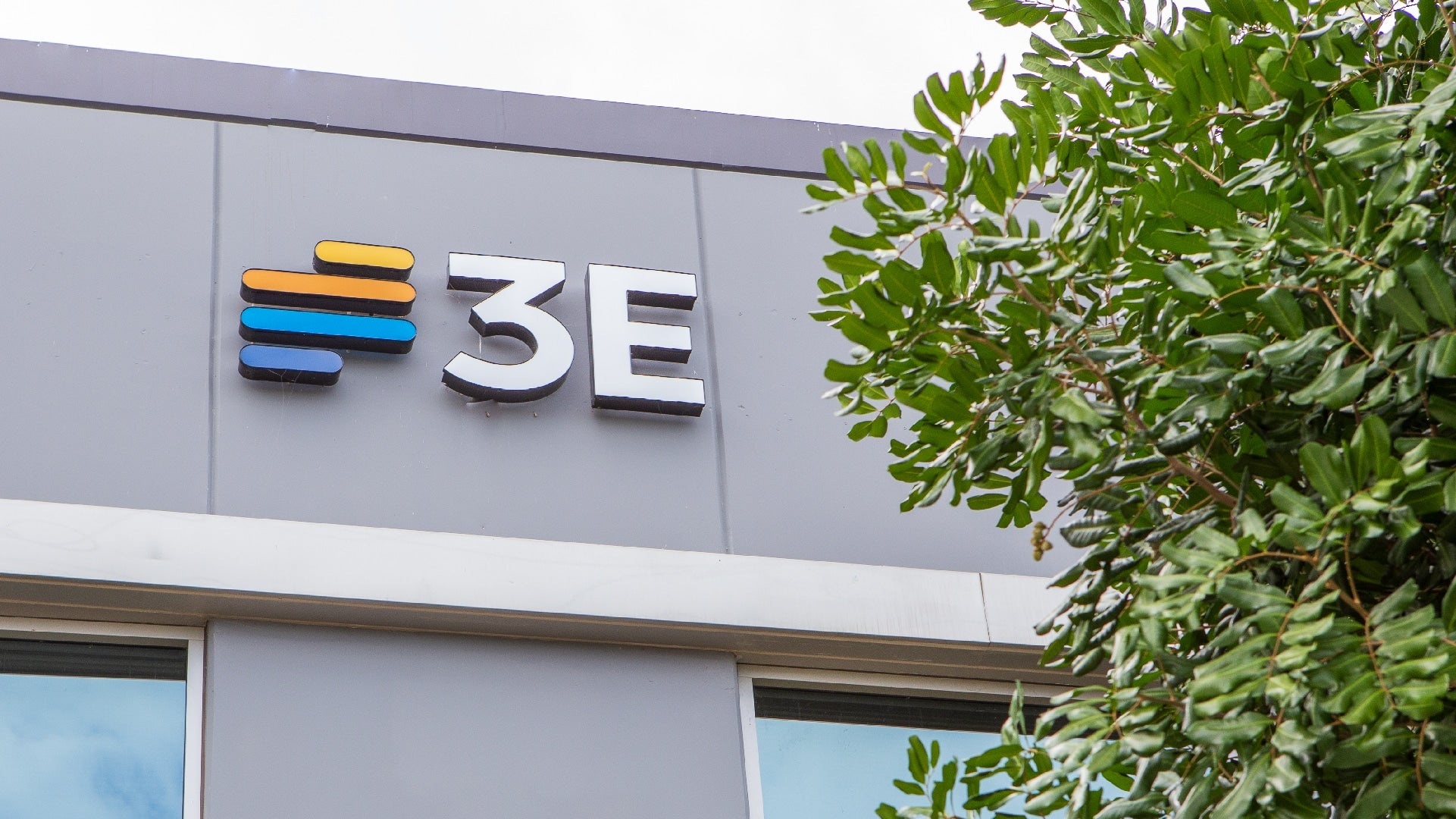 Exterior of an office building with a 3E sign