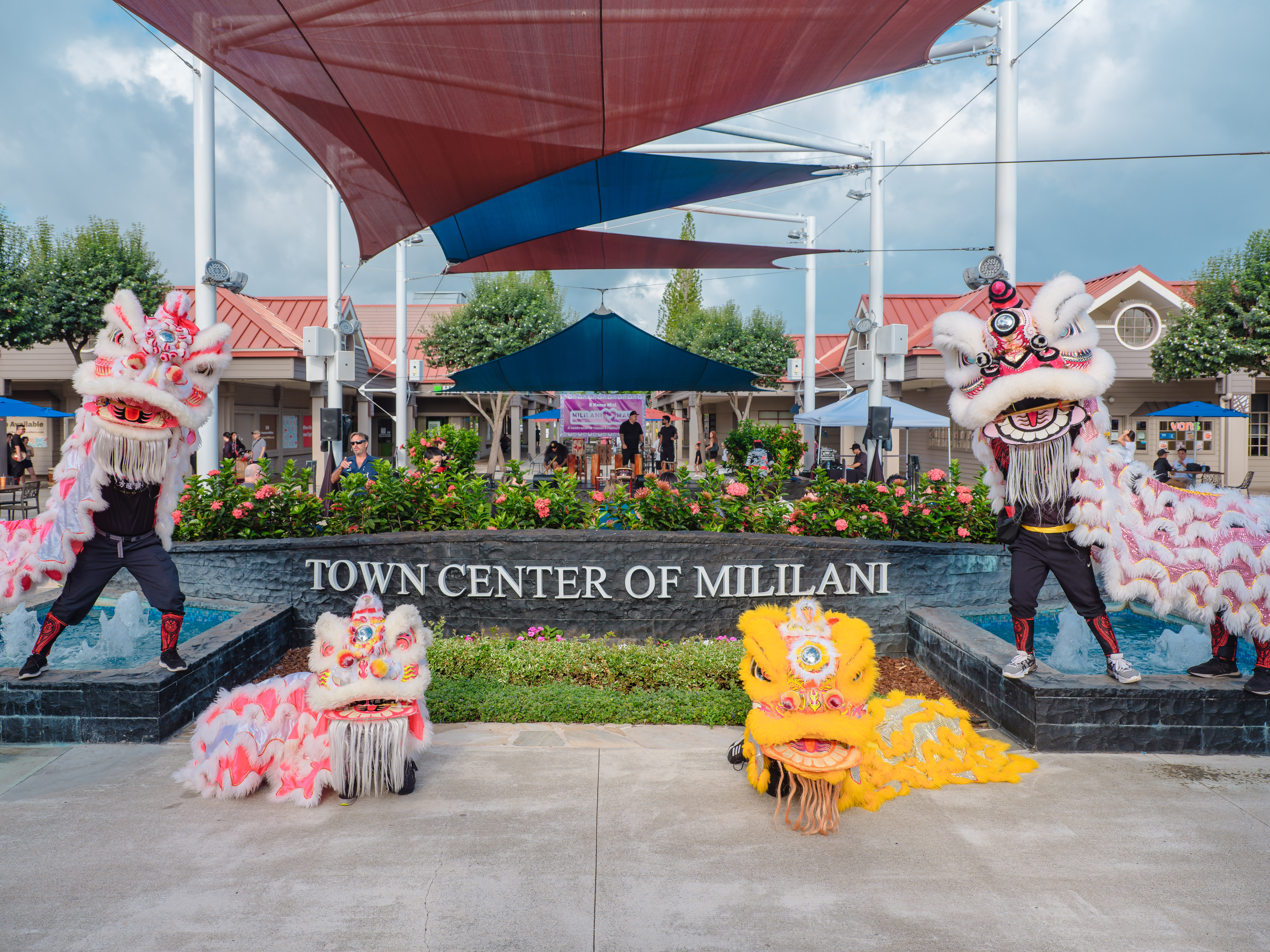 Lion dancers perform at Town Center of Mililani during a community event