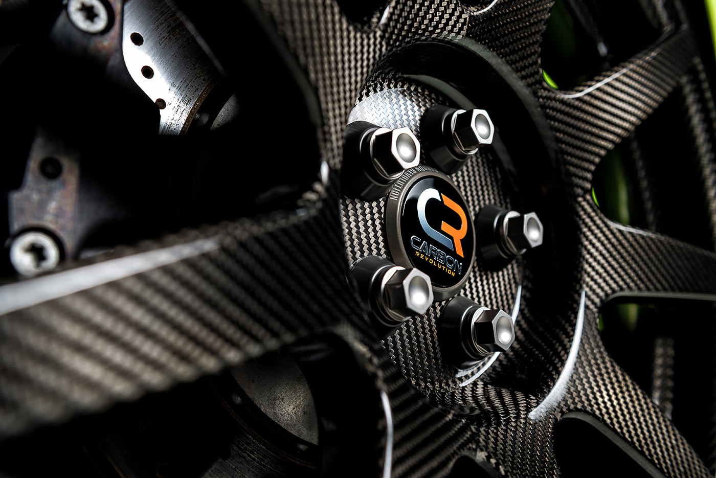 Close view of a carbon-fiber automotive wheel hub and brake rotor