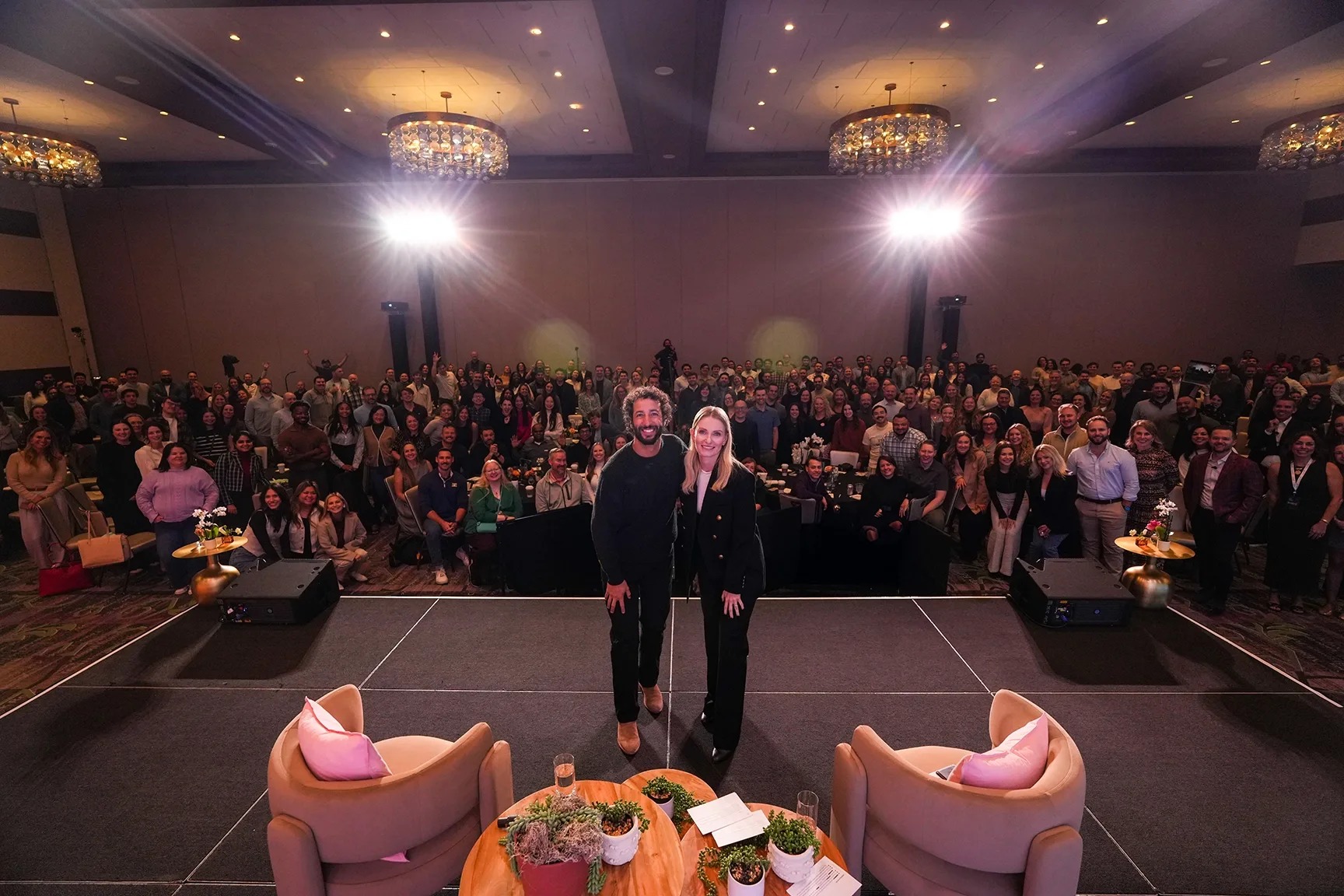 8am employees gathered at the 2026 company kickoff with then-CEO Dru Armstrong and Daniel Ricciardo