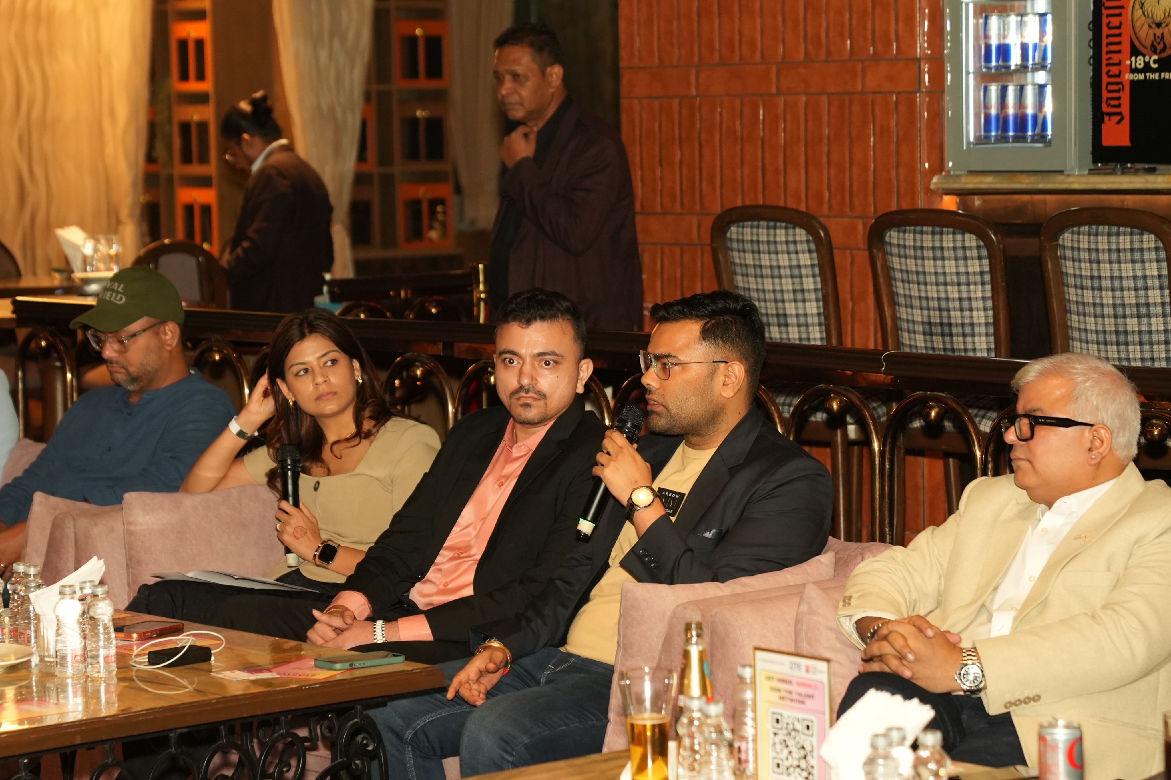 Five seated participants at an 888vc event, with microphones during a discussion