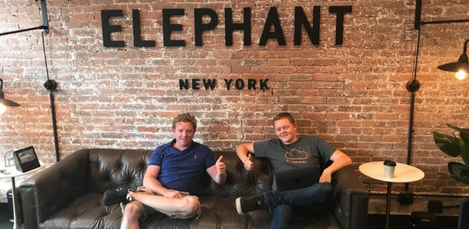 A Cloud Guru founders Ryan Kroonenburg, left, and Sam Kroonenburg, right, sitting on a couch