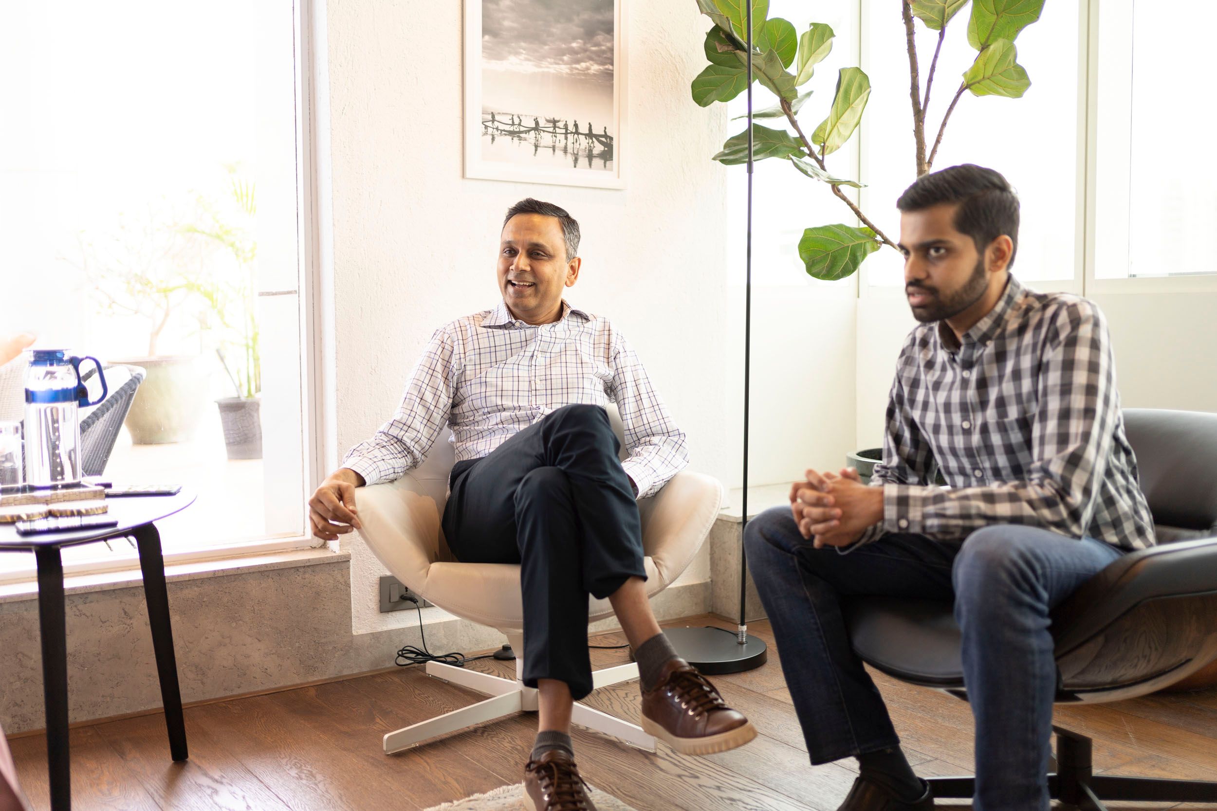 Two people seated in a bright office in A91 Partners’ official team gallery