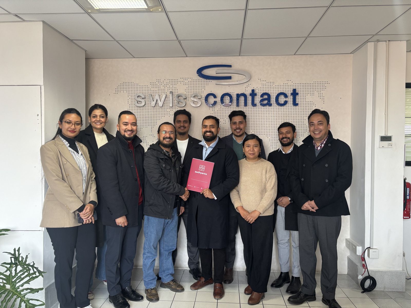 Participants gathered at Swisscontact for the DV Excellus and Aadhyanta investment announcement
