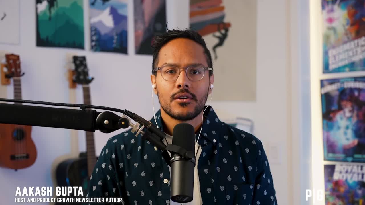 Aakash Gupta speaking into a microphone during a Product Growth podcast recording