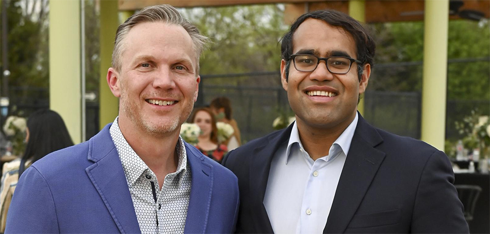 Shiftsmart co-founders Patrick Brandt, left, and Aakash Kumar, right, smiling outdoors.