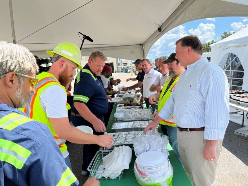 Aaron Erter and colleagues sharing a buffet lunch with Prattville employees