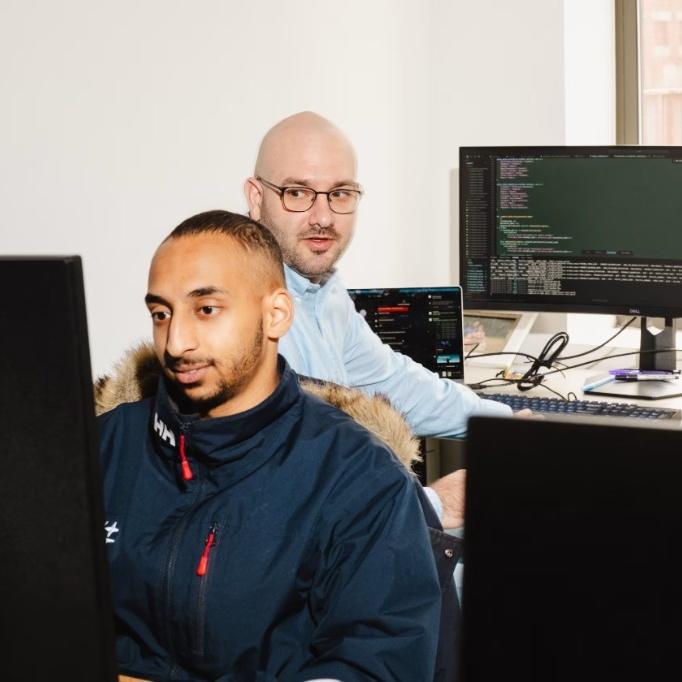 Aaru team members working together in the office