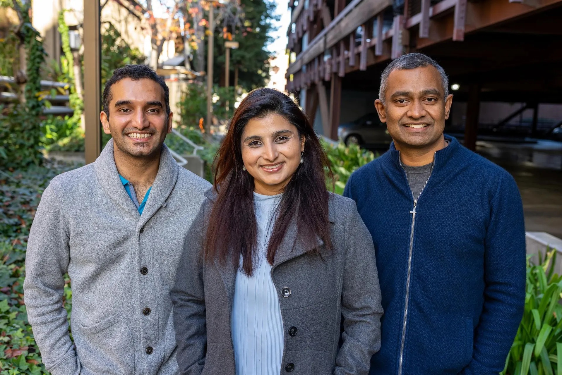 MinIO founders Harshavardhana, Garima Kapoor and Anand Babu Periasamy standing together outdoors