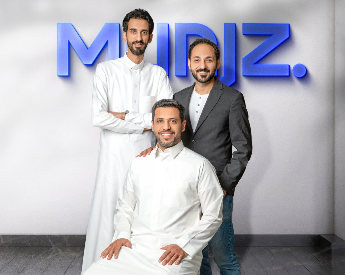 Abdullah AlDaij seated with Jassem Al-Omran standing on the left and Ali Alhammali on the right at Munjz