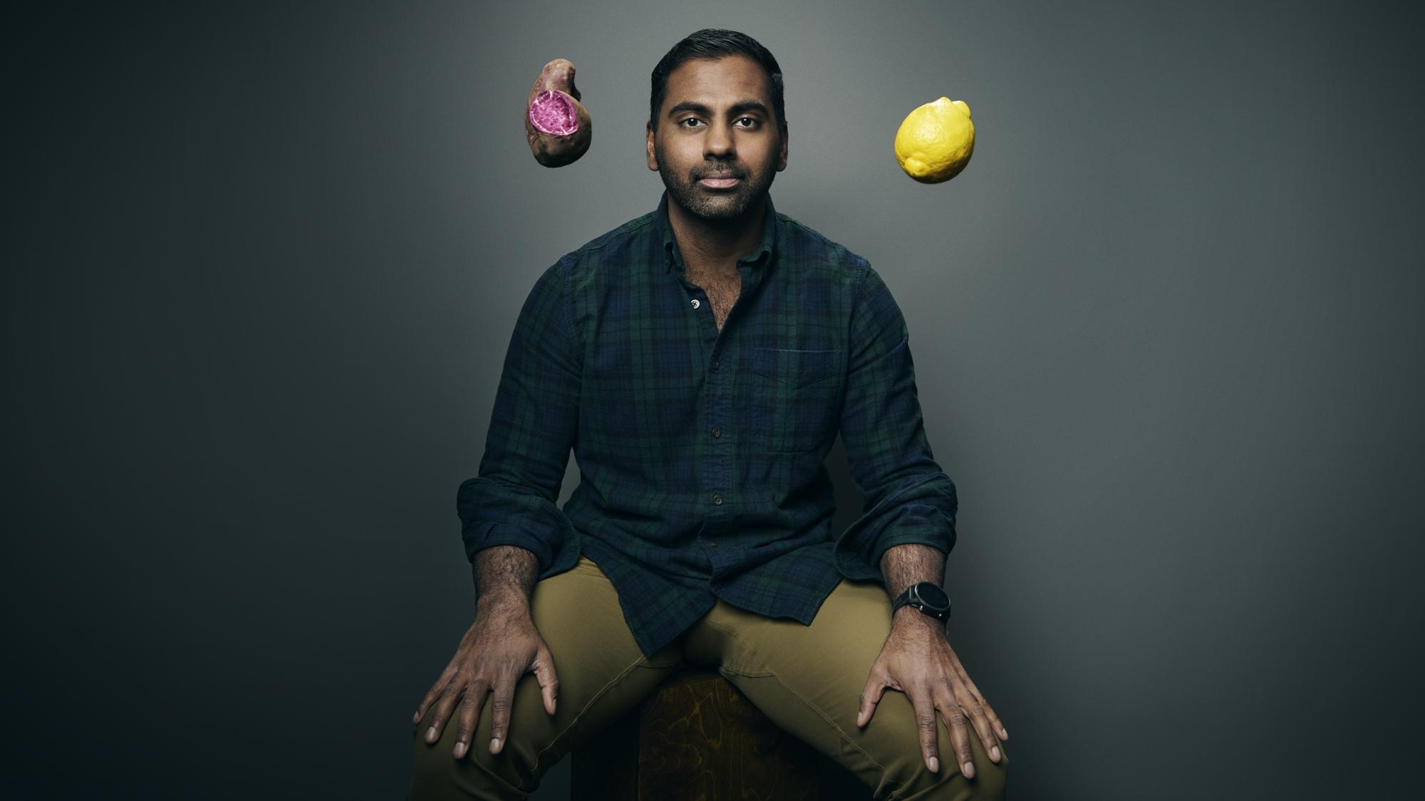 Abhi Ramesh seated between a purple sweet potato and a lemon