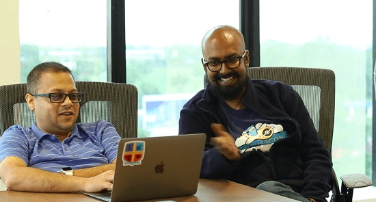 Abinash Tripathy, left, and Baishampayan Ghose seated together behind a laptop