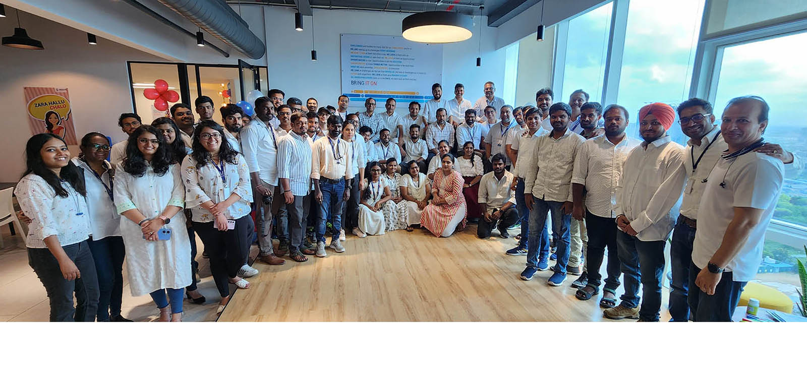 Abjayon colleagues gathered for a group photograph in an office