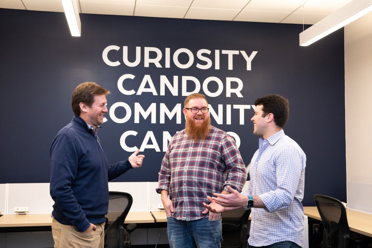Acadia leadership group in an office, in a photograph published on its About Us page