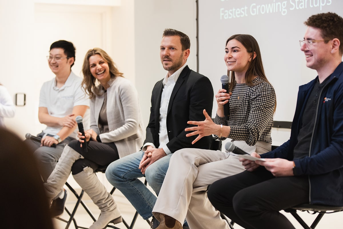 Startup founders and a moderator discussing their experiences at the AC:Studio Innovation Showcase