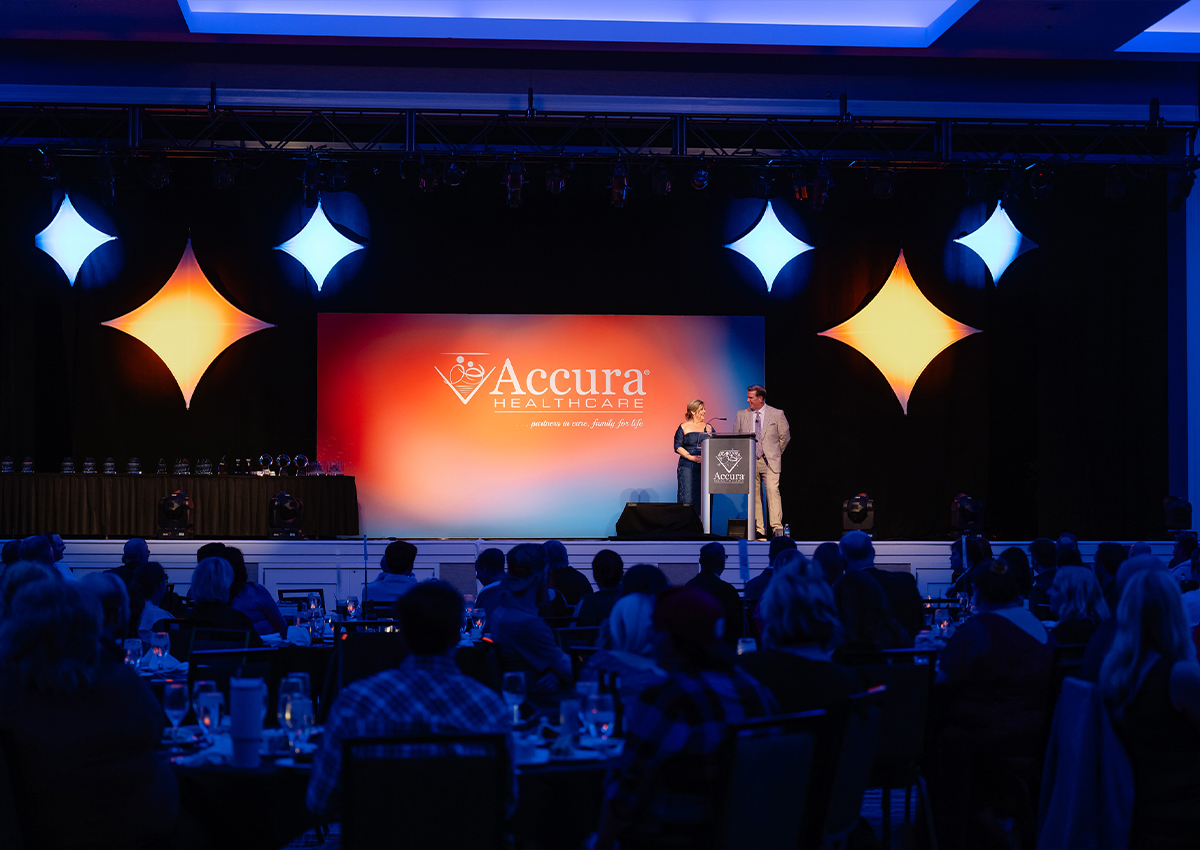 Accura HealthCare leaders onstage at the company's 2026 annual awards banquet