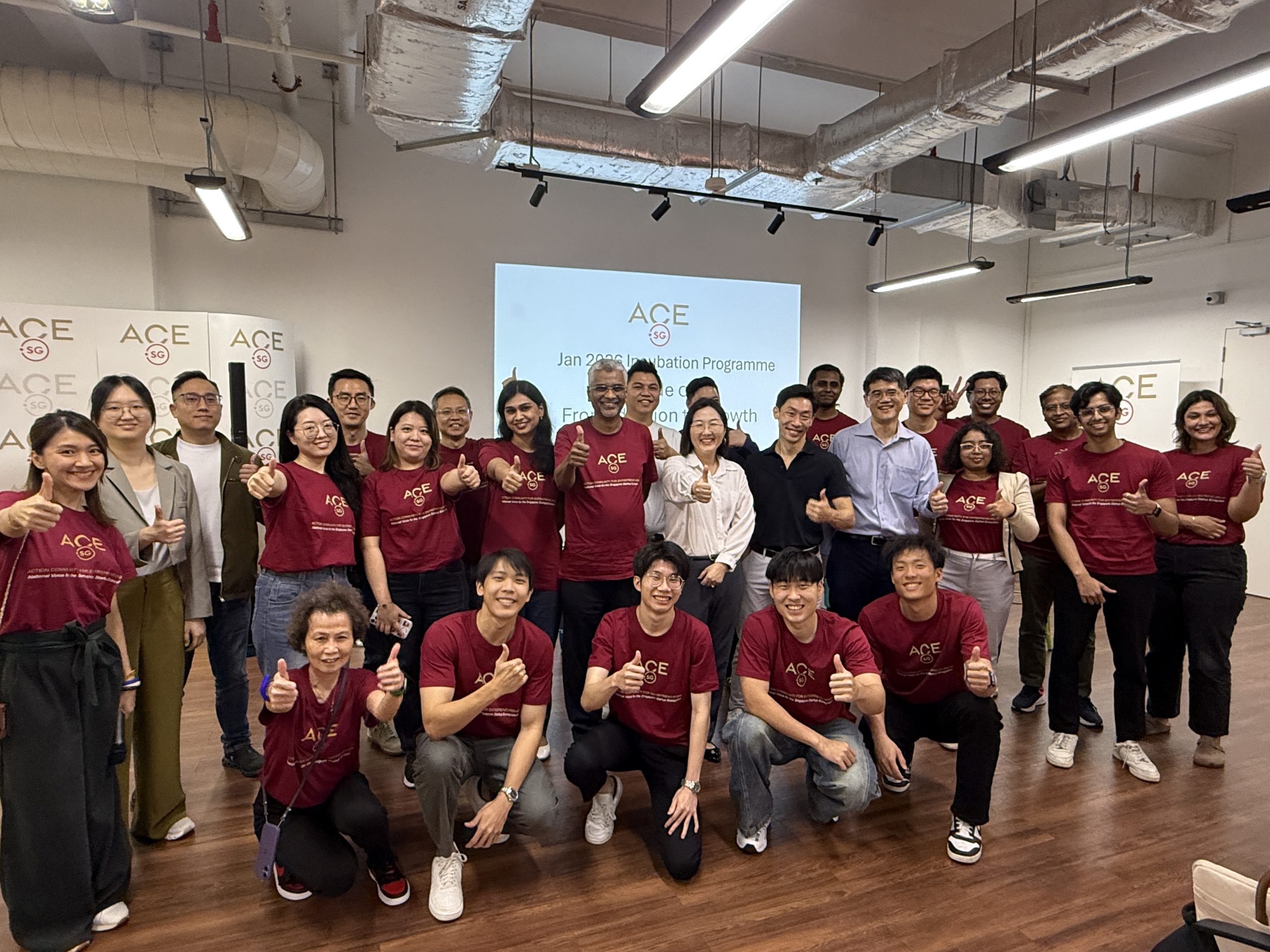 ACE.SG incubation programme group posing together in a workshop room