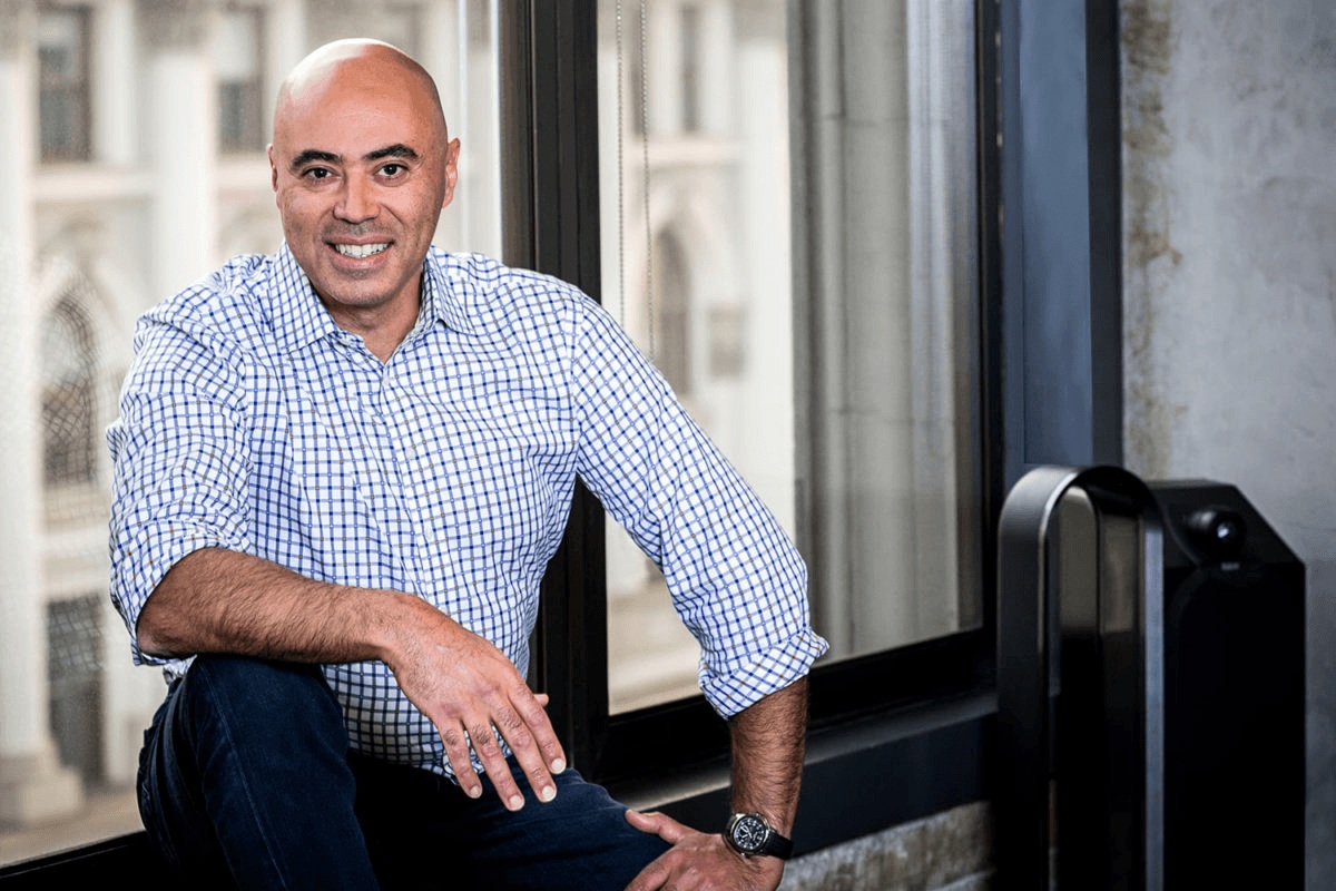 ACME co-founder Hany Nada seated by an office window