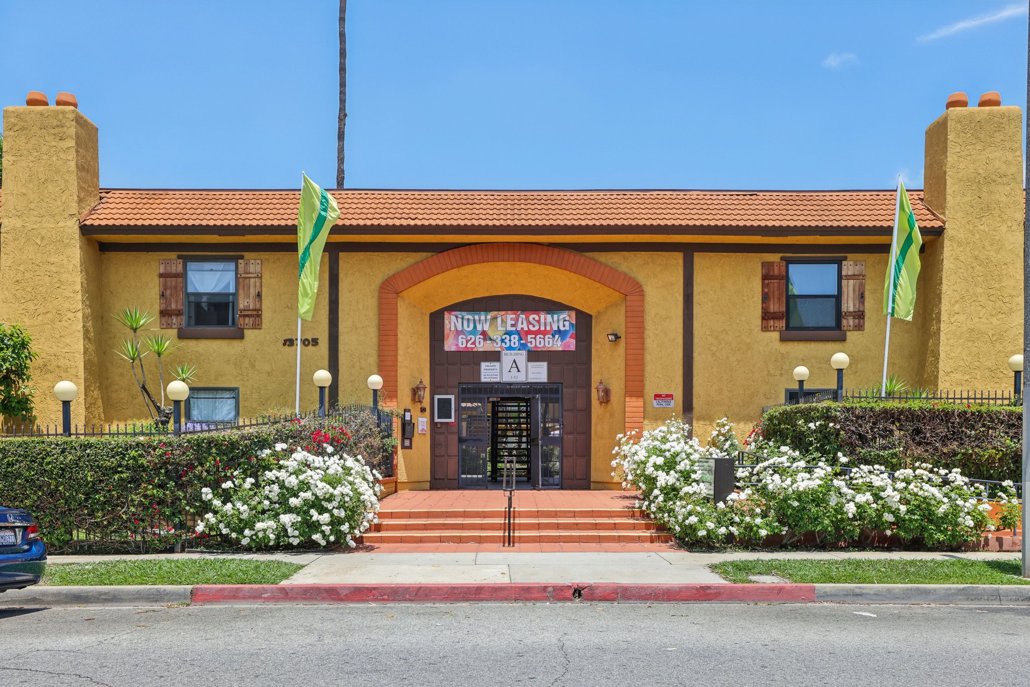 Landscaped entrance and steps at the apartment property at 13705 Sunkist Drive in La Puente