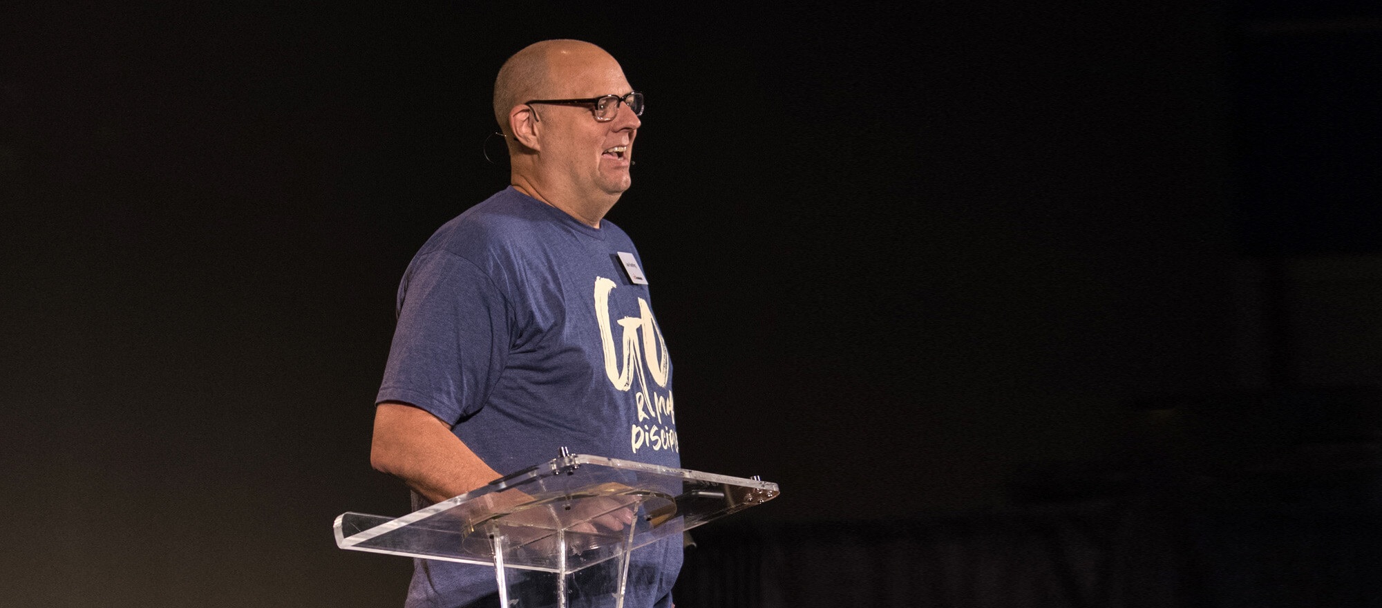 ACS Technologies CEO Joe Koehling speaking at a lectern