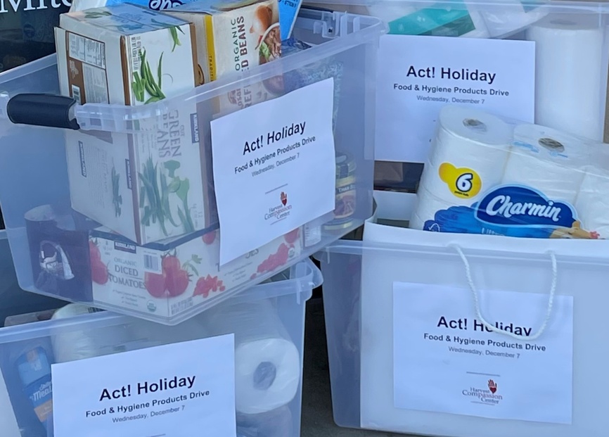 Food, toiletries and household supplies collected in bins for an Act! holiday donation drive