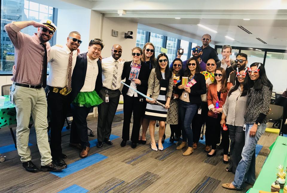 Acumen Solutions bootcamp participants posing together outdoors