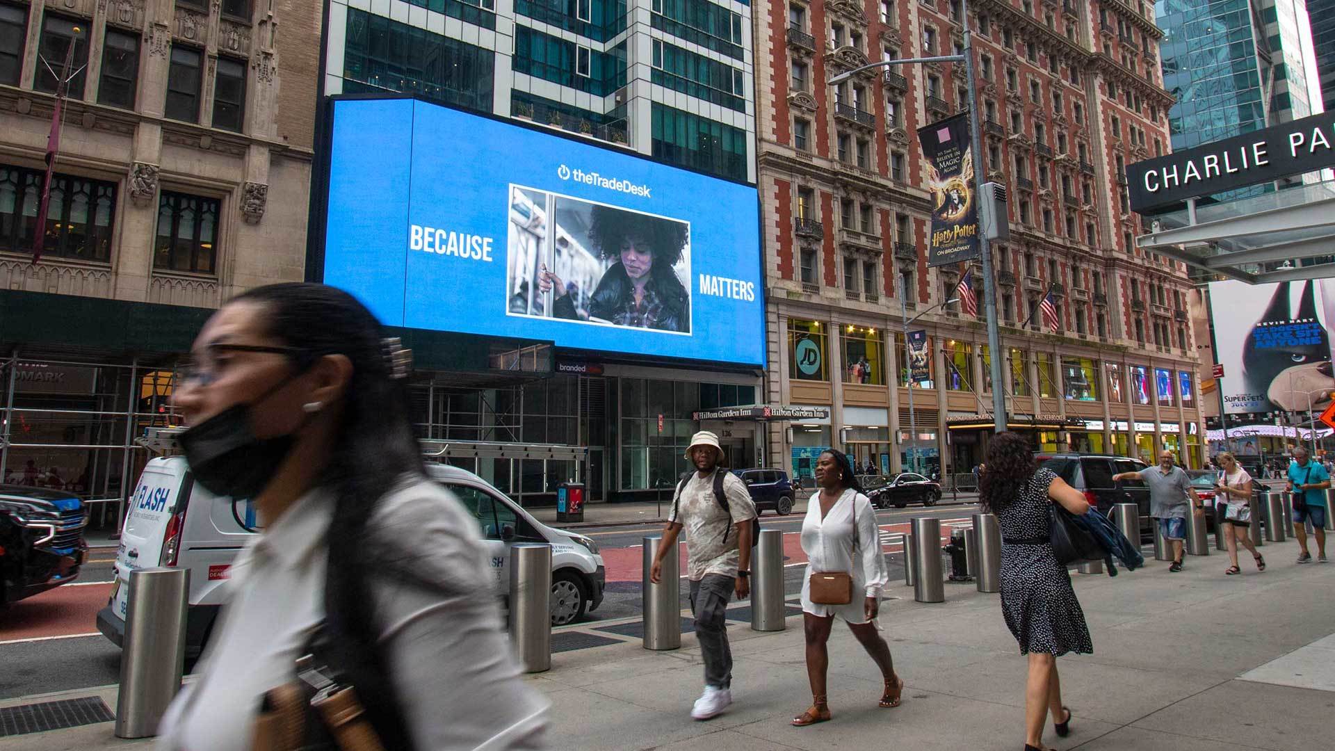 A large digital billboard for The Trade Desk above a New York street