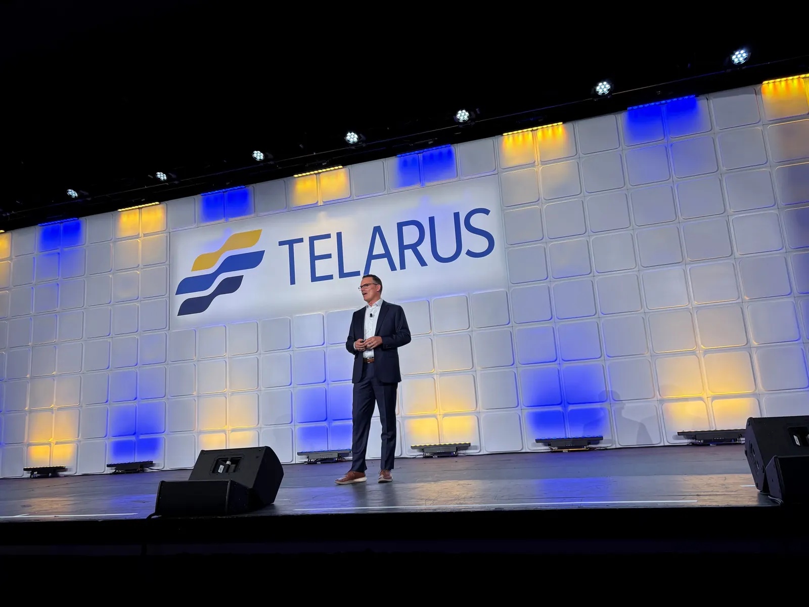 Adam Edwards speaking on the Telarus Partner Summit stage in Texas in August 2026