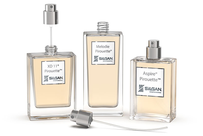 Three Silgan Pirouette fragrance bottles, with a removable pump displayed beside them