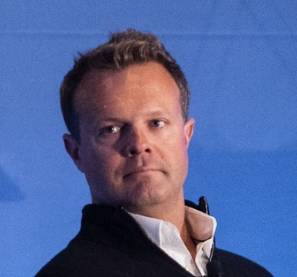 Adam Jackson pictured against a blue background