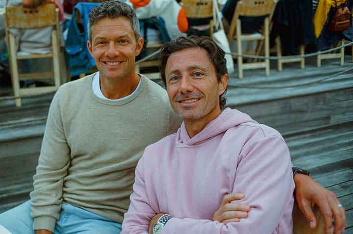 Adam Lynch, left, seated beside Marine Layer cofounder Mike Natenshon outdoors