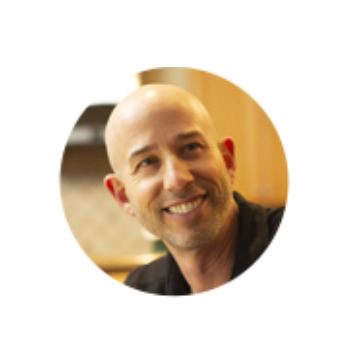 Adam Smithline smiling in a candid portrait