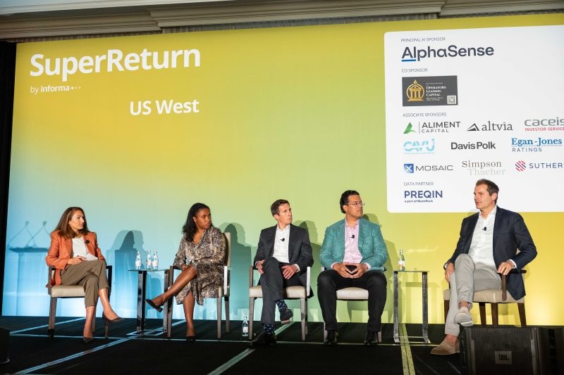 Adam Waglay seated on a panel with fellow speakers at SuperReturn US West