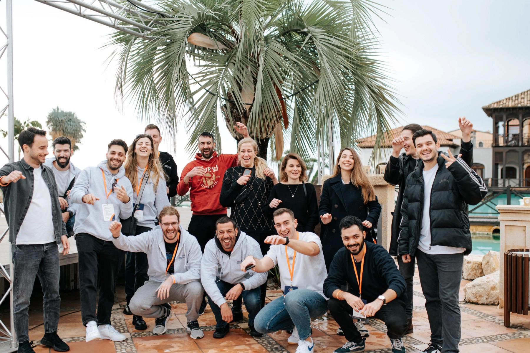 Members of the Adaptavist team smiling together at an outdoor event
