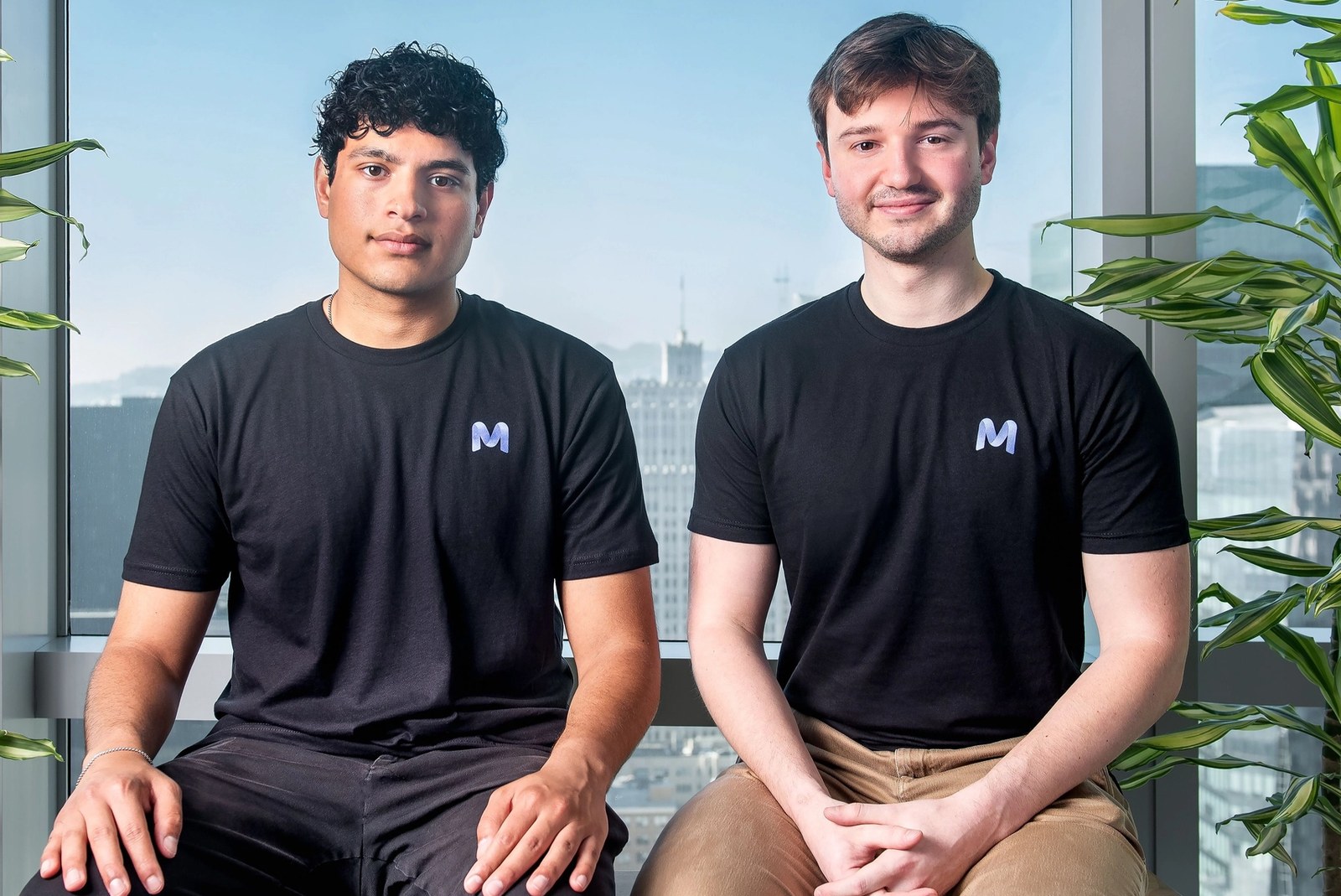 Adarsh Hiremath, left, seated beside Mercor co-founder Brendan Foody