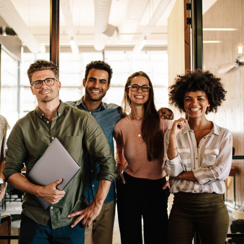 Four colleagues pictured in Aderant’s careers-page photography