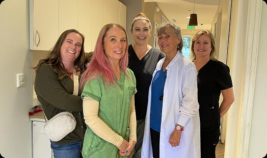 Petaluma Dental Group team members standing together in a practice hallway