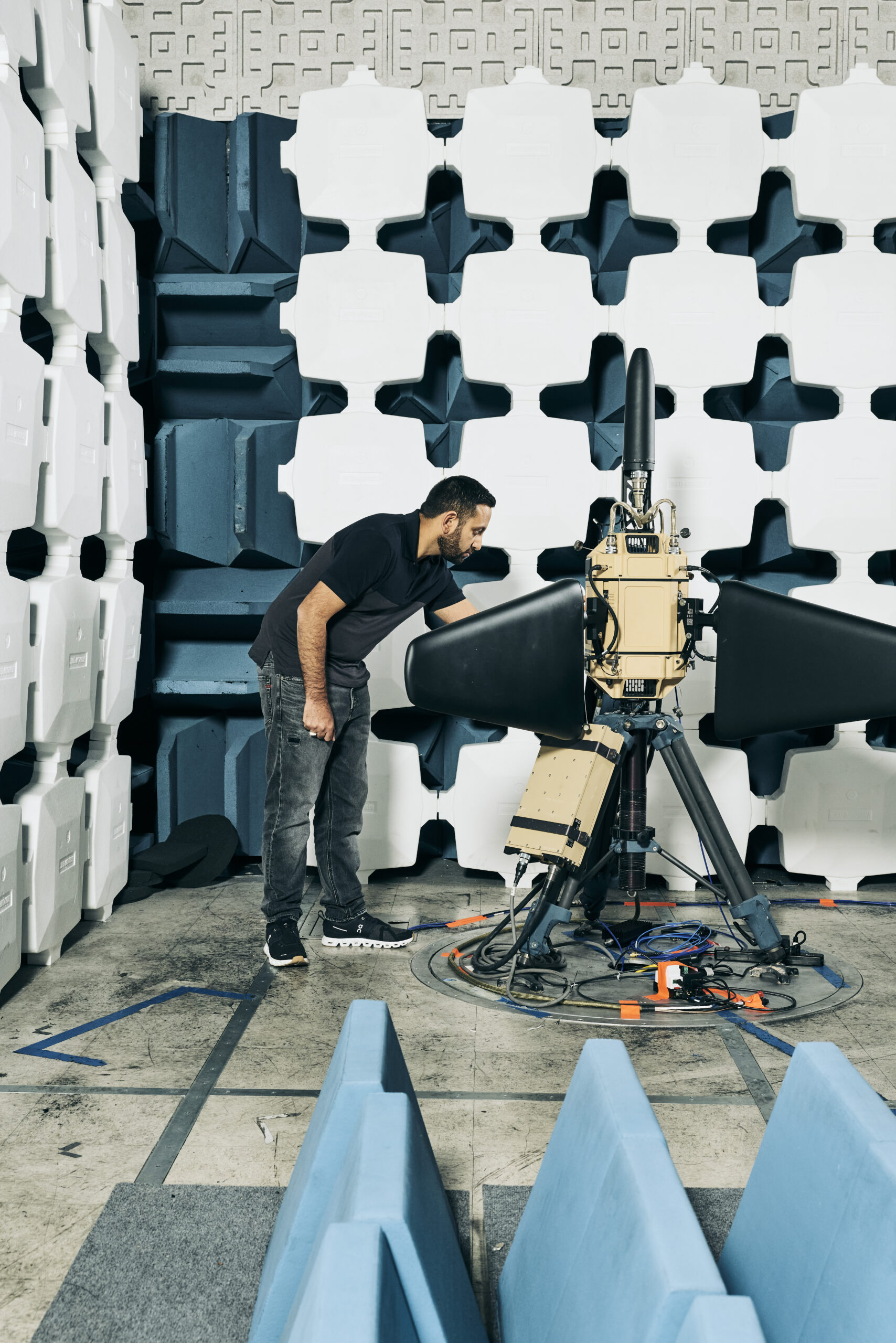 Adnan Esmail adjusting Anduril's Pulsar equipment inside an RF anechoic chamber