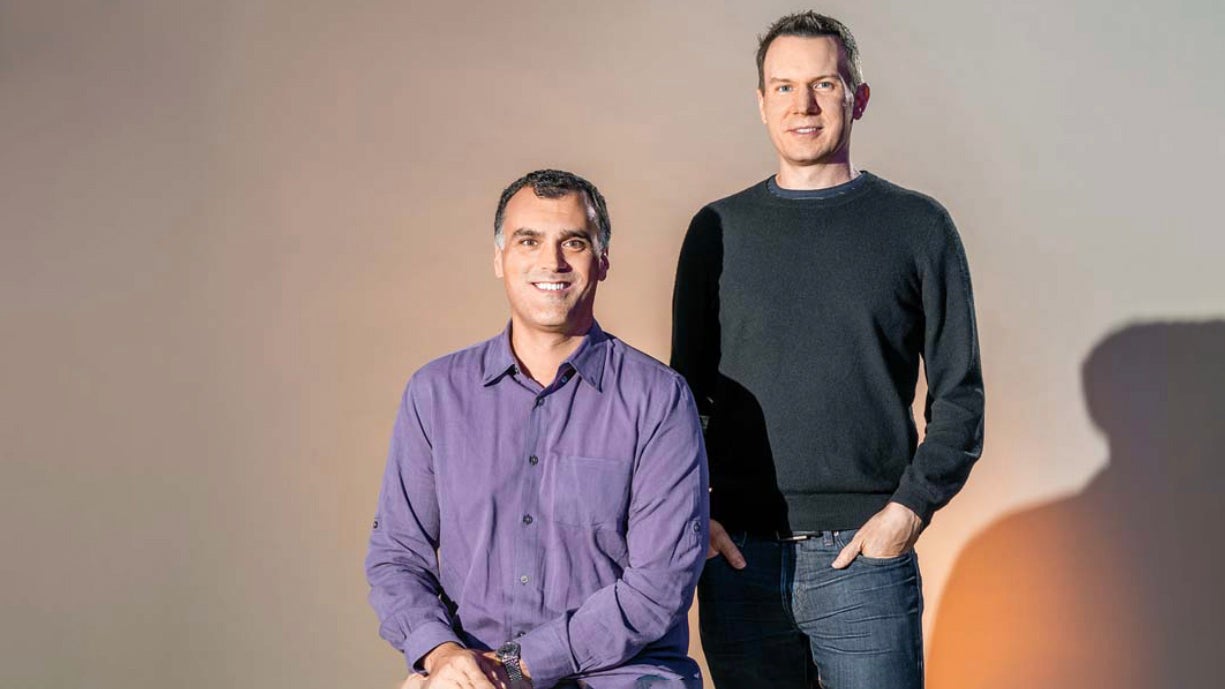 Seesaw co-founders Carl Sjogreen, seated at left, and Adrian Graham, standing at right