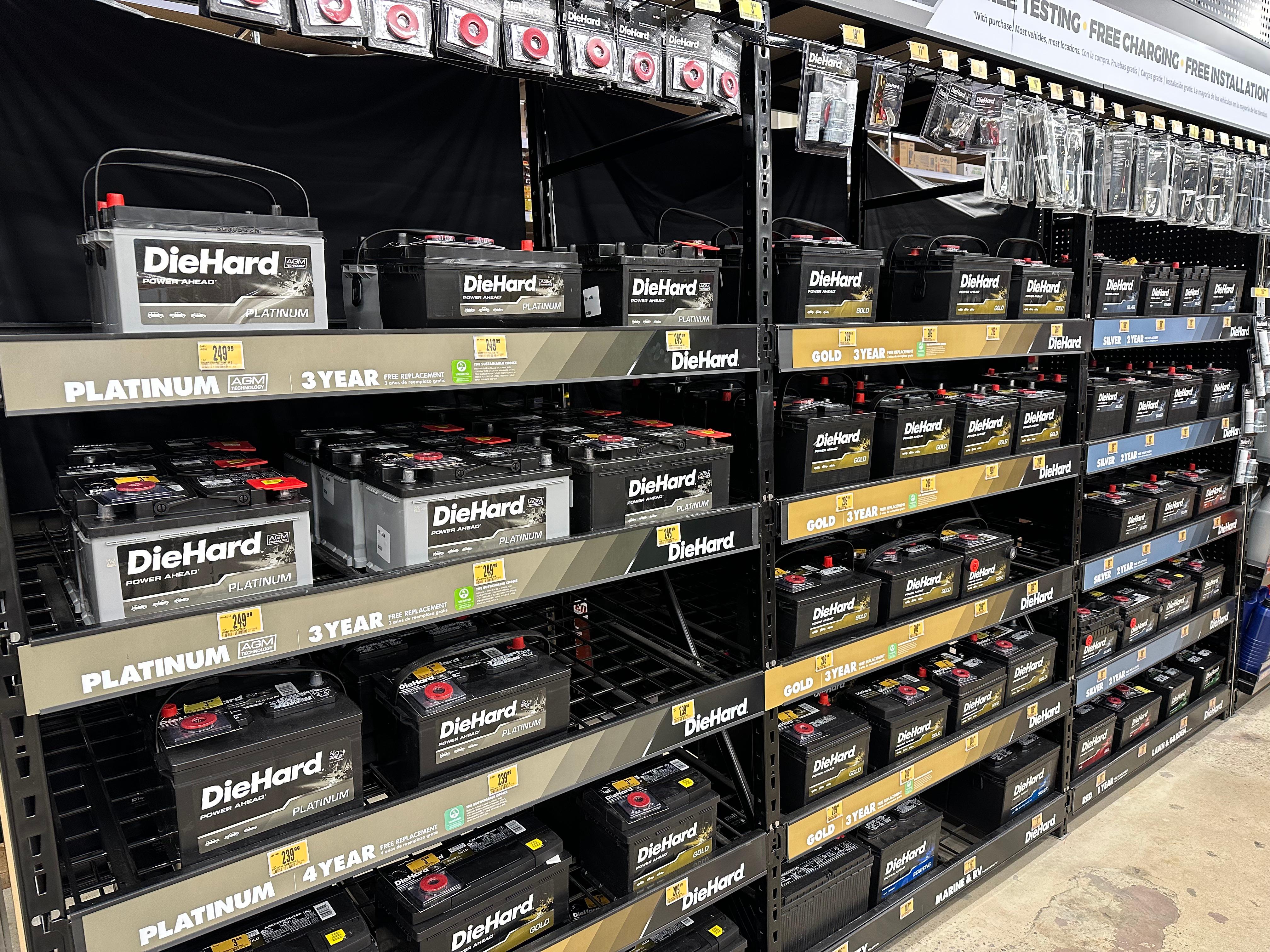 Rows of DieHard Platinum, Gold and Silver batteries in an Advance Auto Parts store