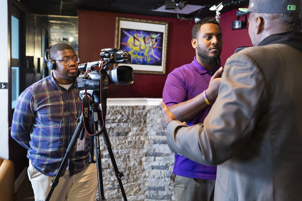 PennLive journalists interviewing former Penn State and NFL linebacker LaVar Arrington