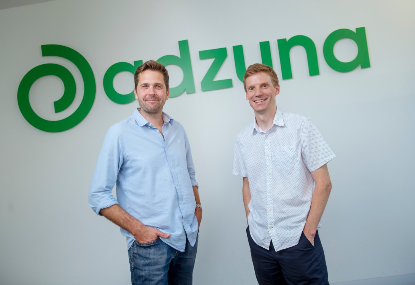 Adzuna co-founders Andrew Hunter, left, and Doug Monro, right, standing in the office
