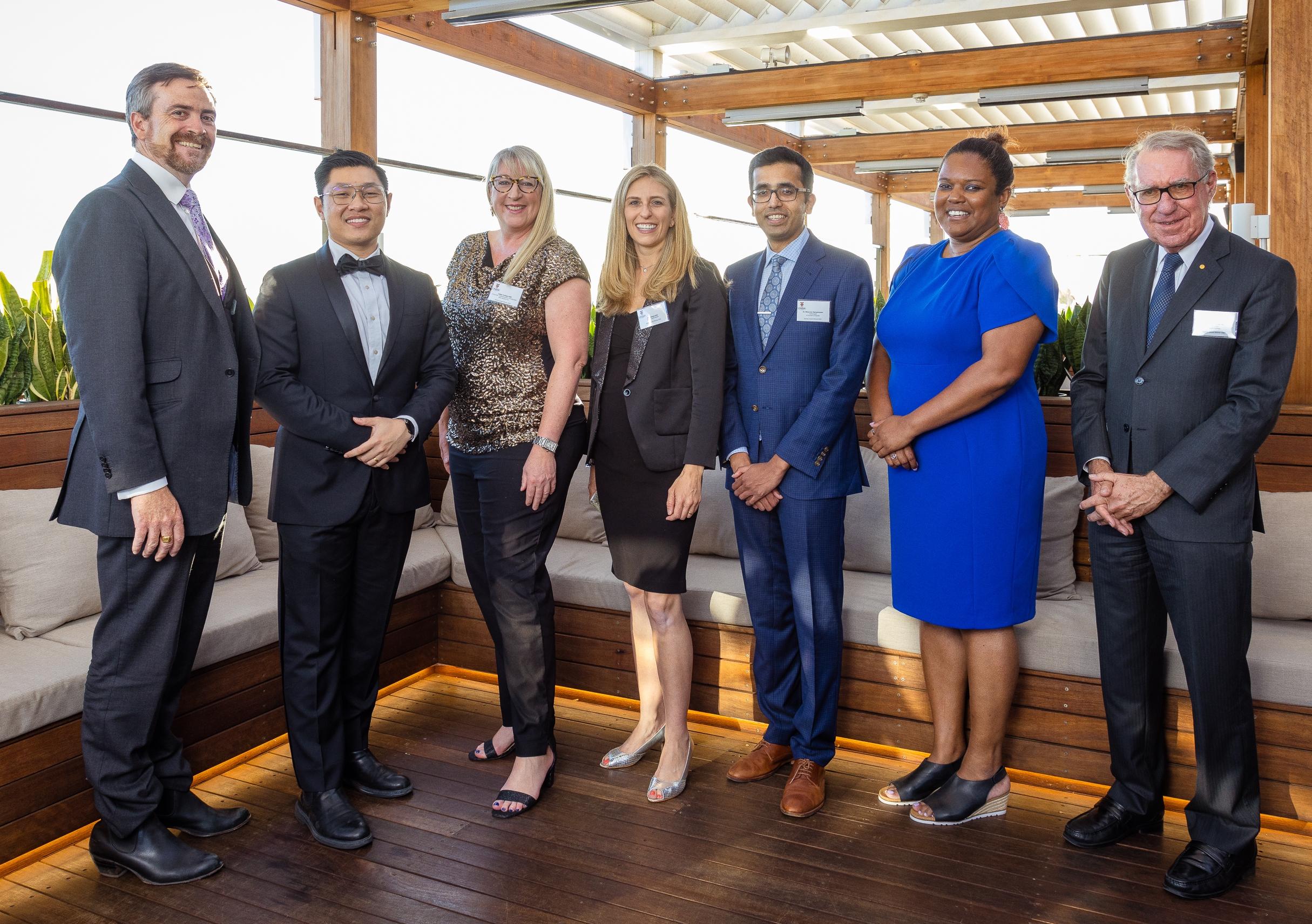 Aengus Tran, second from left, with fellow 2022 UNSW alumni award recipients and university leaders