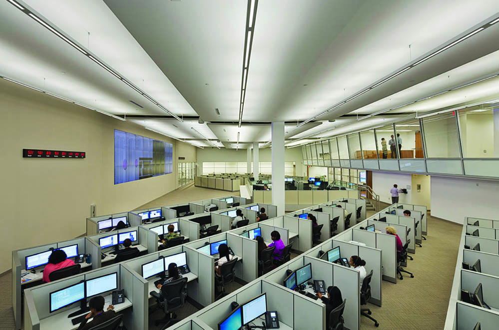 Operators seated at workstations in an Affiliated Monitoring center